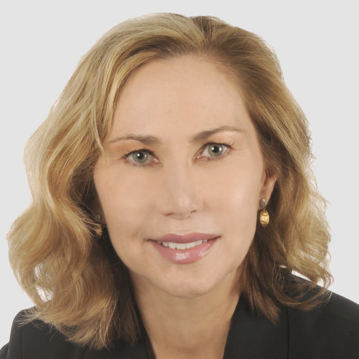 Blonde woman smiling with black suit jacket